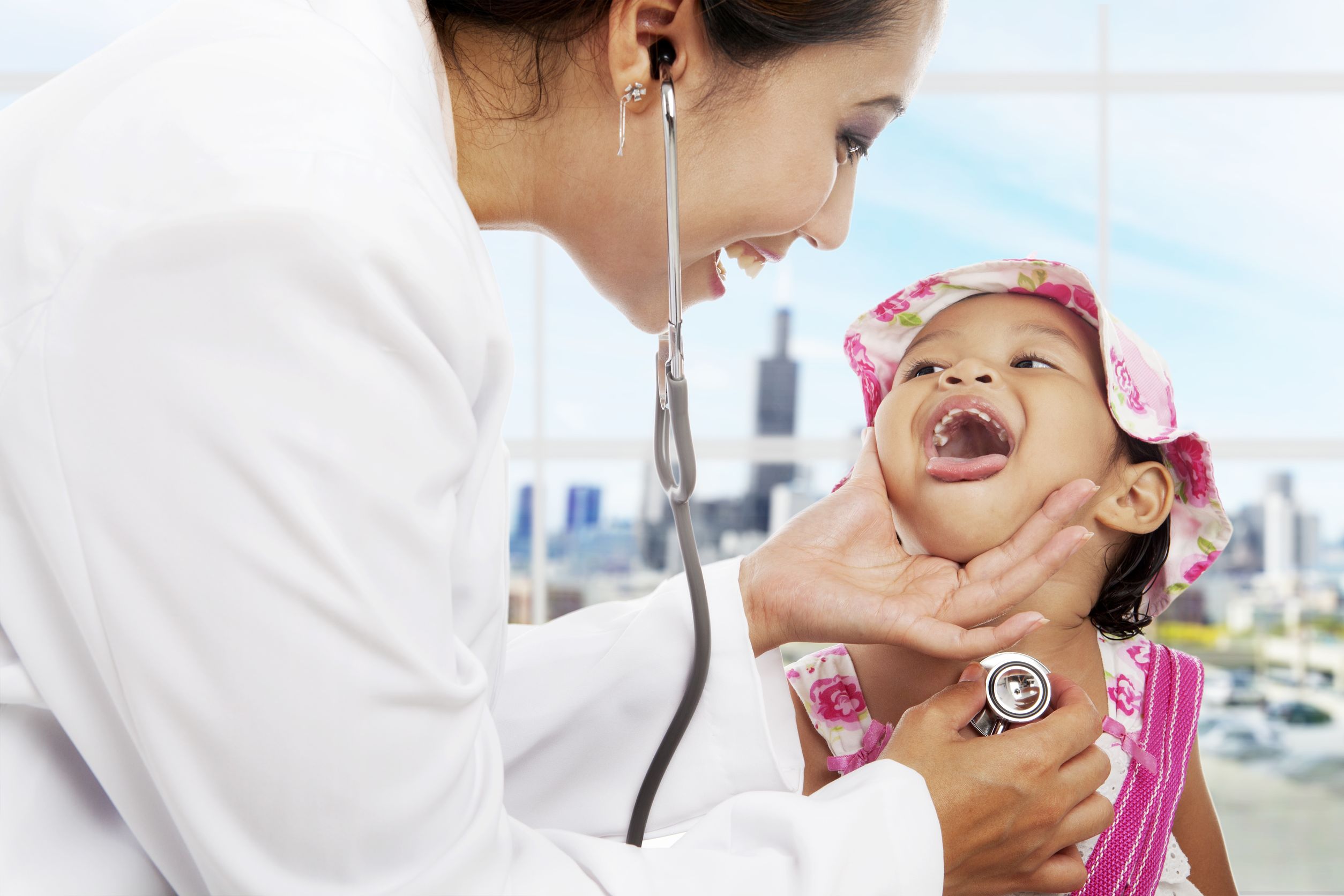 16011232 - a female pediatrician is checking cute girl patient